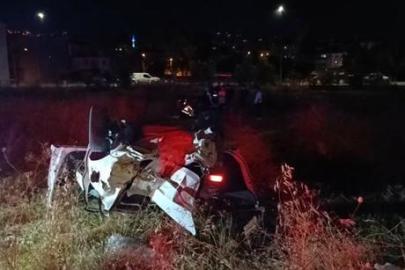 Bursa'da kontrolden çıkan otomobil araziye savrulup takla attı