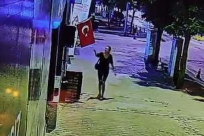 Türk bayrağını çakmakla ateşe verip uzaklaştı! Bayrağa saldıran kadını, kameralar kaydetti
